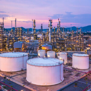 Aerial top view oil and gas chemical tank with oil refinery plan Aerial top view oil and gas chemical tank with oil refinery plant background at twilight.